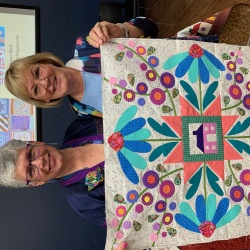 I am teaching in Texas for 10 days. Venetia brought her Homeward Bound to show me. She prepped the background with Terial Magic and it is firm and flat. Machine appliqué with turned edges, using Print n Piece Fuse Light. Spectacular results!