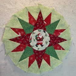 I found this darling Santa fabric and love it for the center!