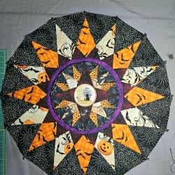 I decided to make my sample center out of Halloween fabrics. Used my embroidery machine to make the center. Liked it so much, decided to make a Halloween project quilt, before the winter wreath.