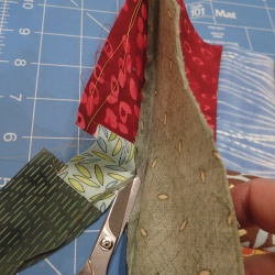 After glue basting, trim the excess 9 patch to the seam allowance for H.