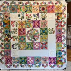 Trying to decide whether to leave the flower corner blocks empty.....I am using Becky Goldsmith but haven't seen a corner block that would work well with these.