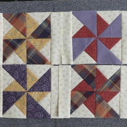 I decided to use pinwheels for my blocks.  I had to make several to get the correct size for the triangles.