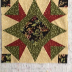 Middle square done. Now on to the other four. Used both cutting techniques including rulers