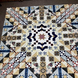 After admiring my quilt and finding a HST in wrong and fixing it, here is my quilt with some variations.
Thanks Lynn and Barbara.  Good tutoring.
Lynn I’d love to see enough of your finished quilt to look at your quilting.  I’m a hand quilter but need inspiration.