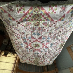 I am pleased with my quilt, now on to quilting it.  I was surprised as how the border made such a difference in the look of the quilt