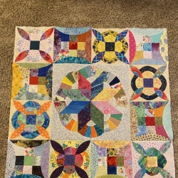 I am so happy to have completed the blocks for month 2and 3.   I have constructed the middle section before the log cabin blocks.  I am a scrap quilter here.  I don’t have a design wall,  so I put the blocks on a bed and tried to place them appropriately.  Thanks for the great lessons Barbara.   It has made this journey doable.   Teresa.